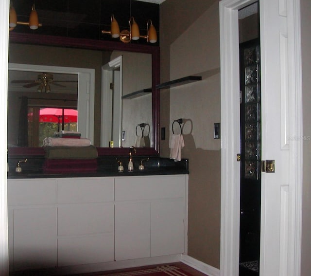 bathroom featuring ceiling fan and vanity