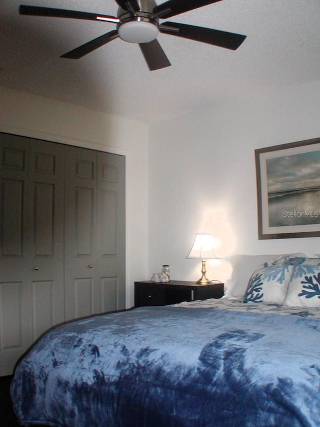 bedroom featuring a closet and ceiling fan