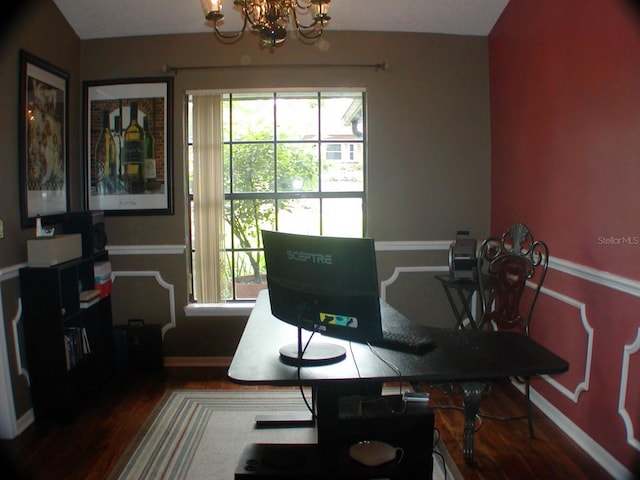 office featuring a wealth of natural light, hardwood / wood-style flooring, a chandelier, and vaulted ceiling