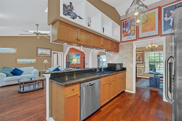 kitchen with stainless steel appliances, sink, a wealth of natural light, and decorative light fixtures