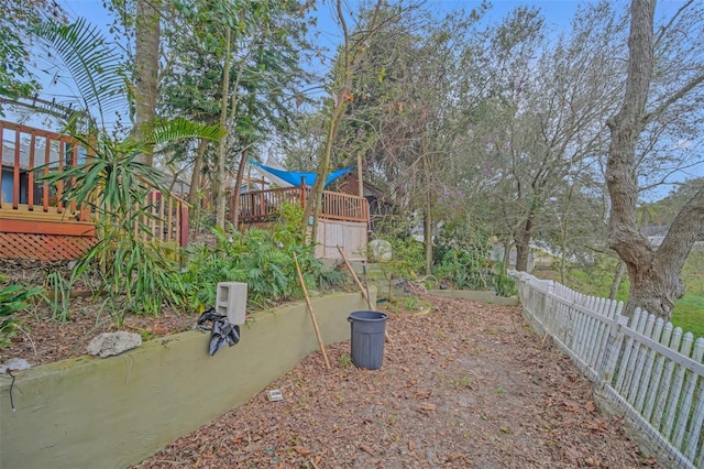 view of yard with a wooden deck