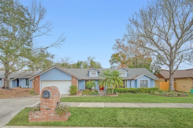 view of front of home featuring a garage and a front lawn