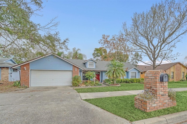 view of front of property with a garage and a front yard