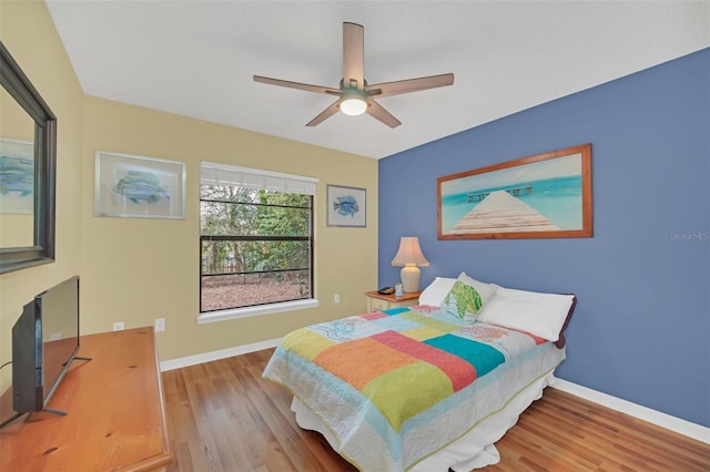 bedroom featuring light hardwood / wood-style floors and ceiling fan