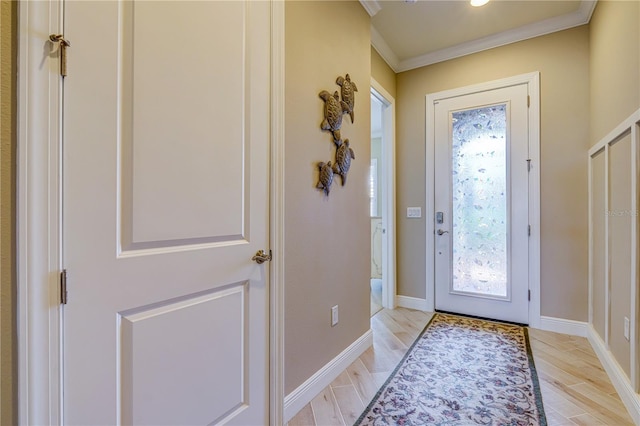 foyer featuring crown molding and light hardwood / wood-style flooring