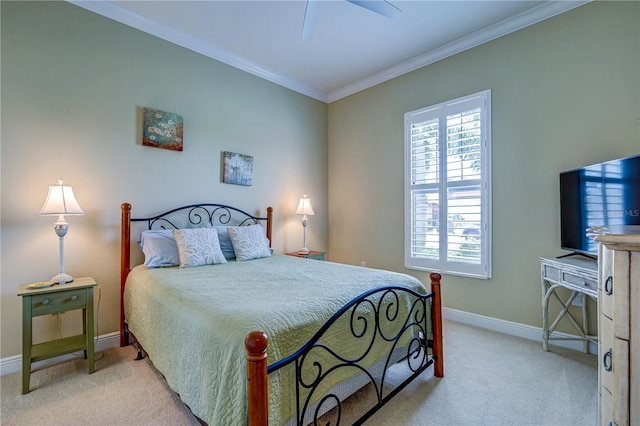 bedroom with crown molding, light colored carpet, and ceiling fan