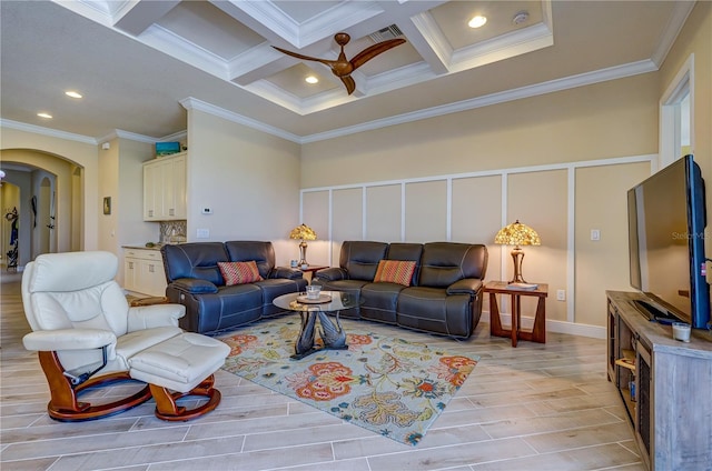 living room with beamed ceiling, light wood-type flooring, ceiling fan, crown molding, and coffered ceiling