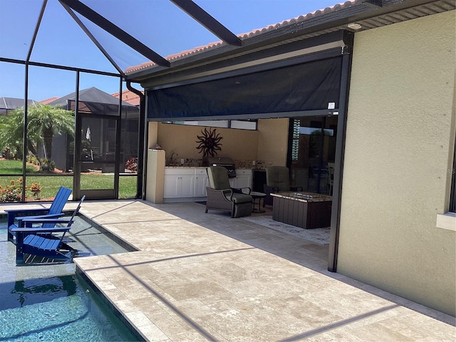 view of patio / terrace featuring glass enclosure