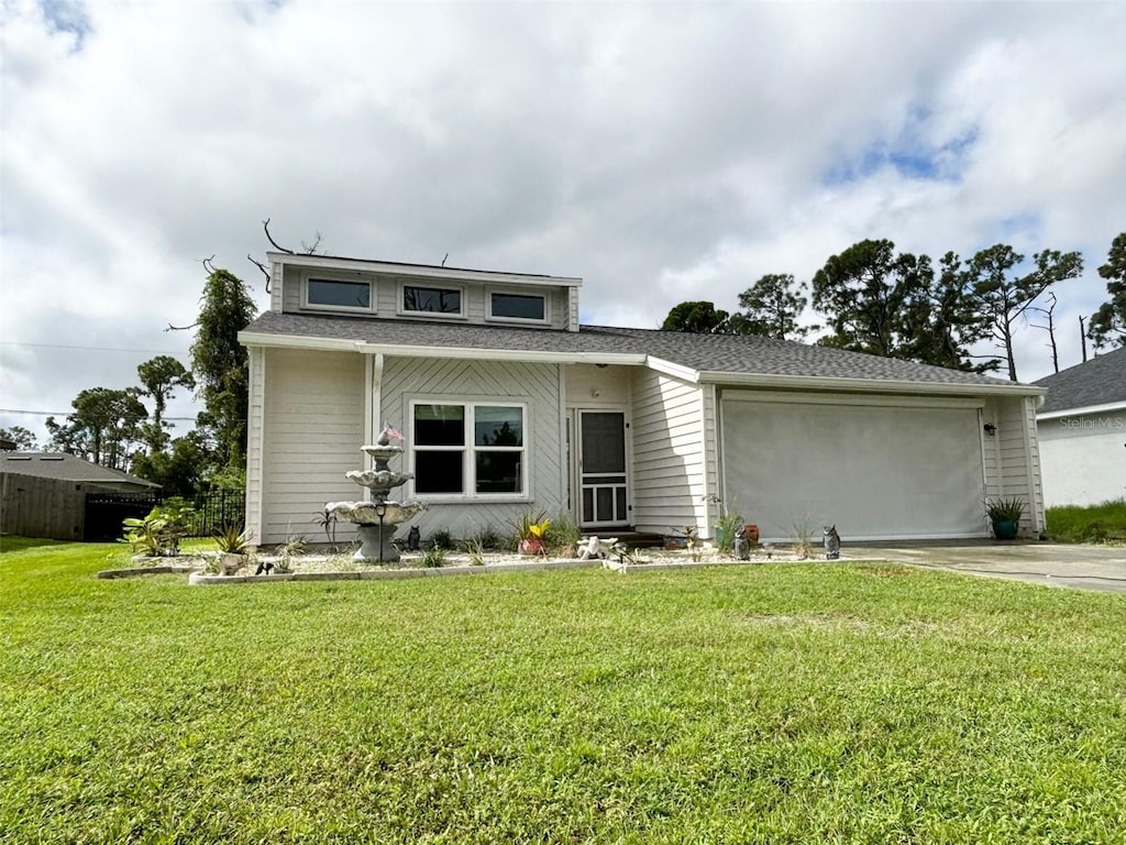 view of front facade featuring a front lawn and a garage