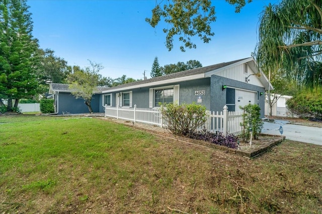 view of front of home with a front lawn and a garage