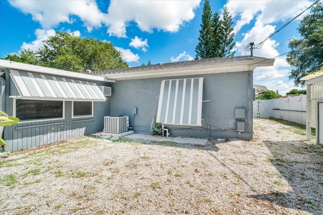 back of house featuring central AC