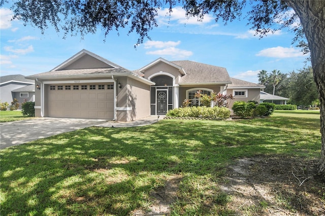 ranch-style home with a front yard and a garage