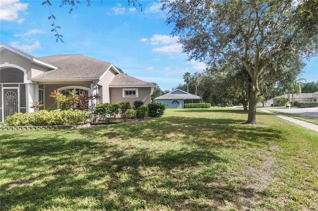 exterior space with a lawn and a garage