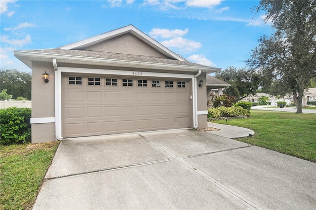 garage featuring a lawn