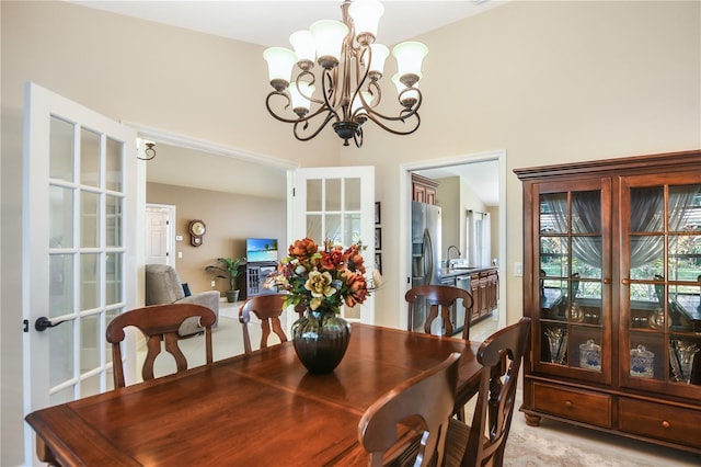 dining area with an inviting chandelier