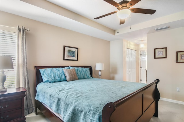 tiled bedroom with a closet and ceiling fan