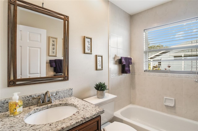 full bathroom with vanity, toilet, and shower / tub combination