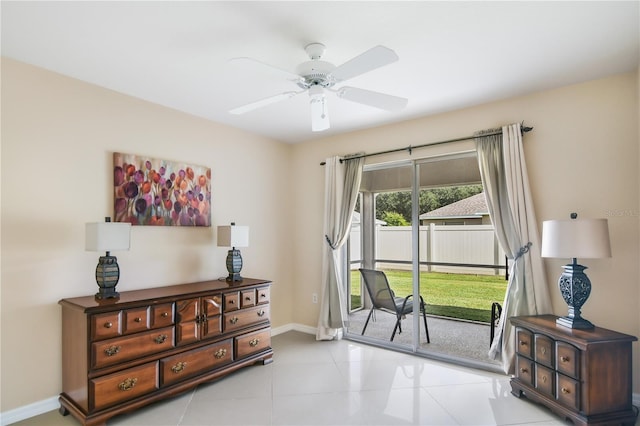 interior space with light tile patterned flooring and ceiling fan