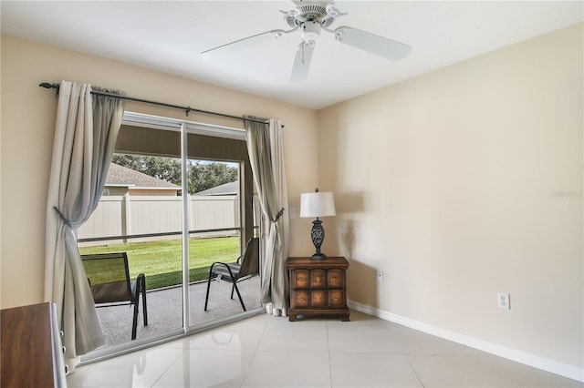 doorway to outside featuring light tile patterned flooring and ceiling fan