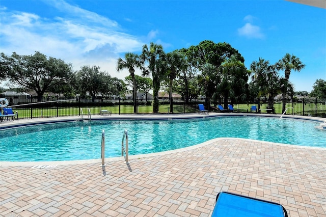 view of swimming pool with a patio area