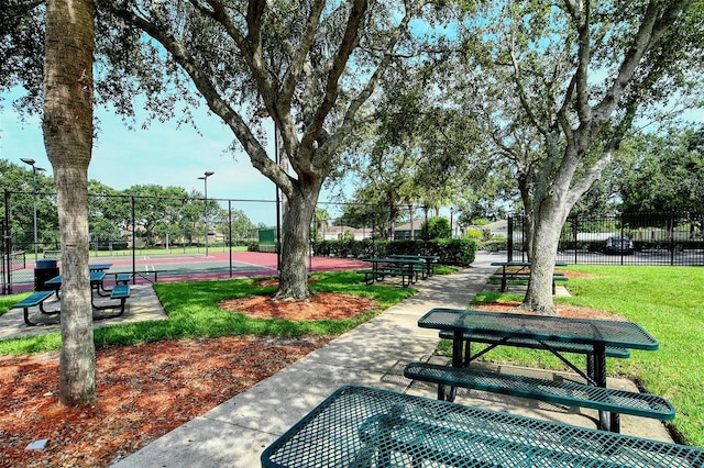 view of property's community with a lawn