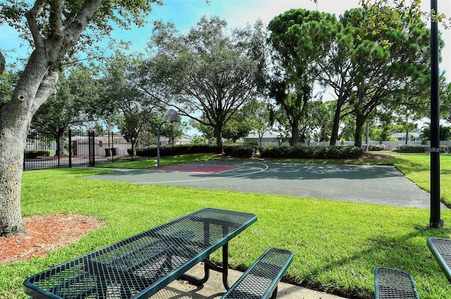 view of basketball court featuring a lawn