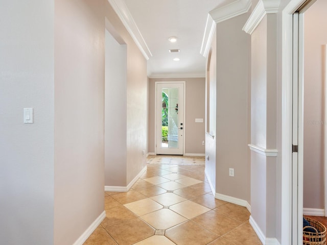 interior space featuring crown molding and light tile patterned floors