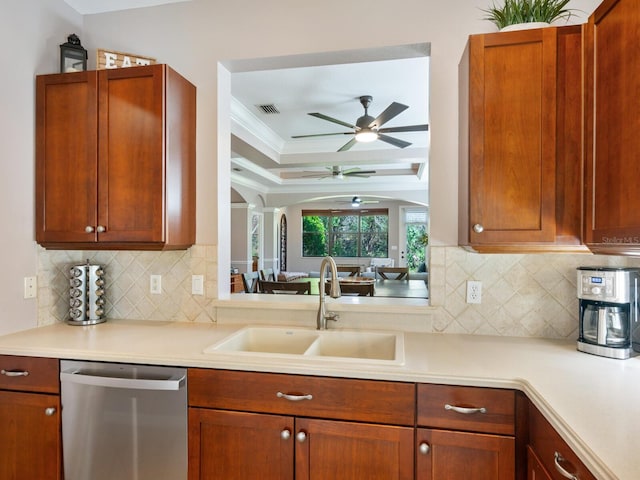 kitchen with dishwasher, tasteful backsplash, sink, and ceiling fan