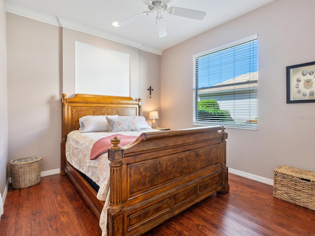 bedroom featuring ceiling fan, ornamental molding, and dark hardwood / wood-style floors