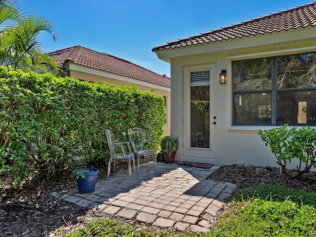 doorway to property featuring a patio area