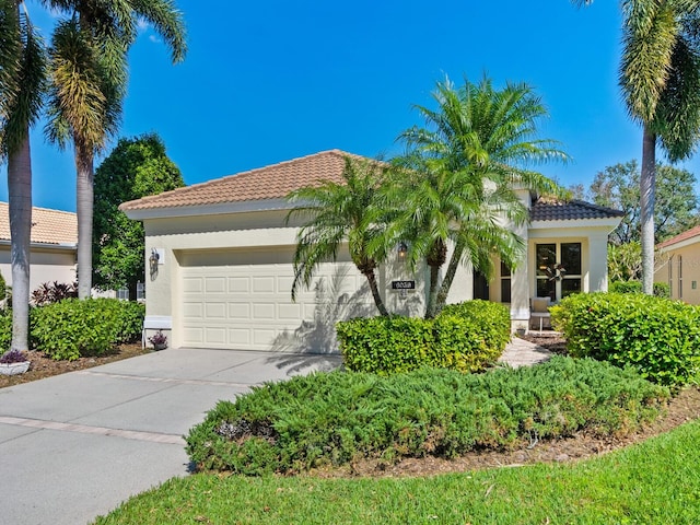 mediterranean / spanish house featuring a garage