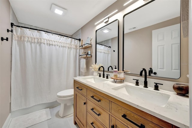 bathroom featuring vanity, walk in shower, tile patterned flooring, and toilet