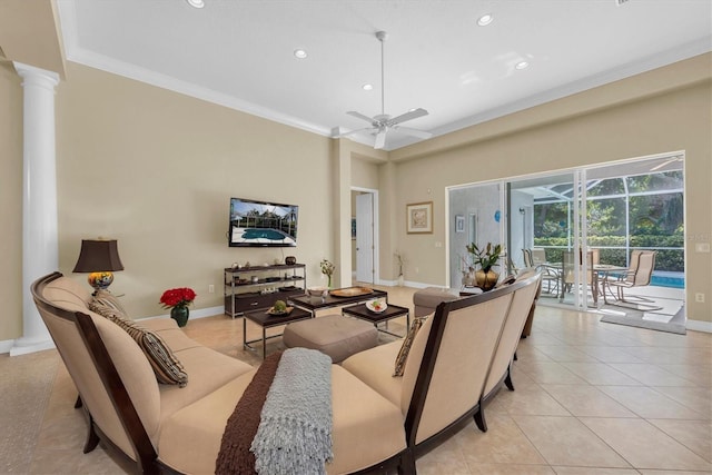 tiled living room with ornate columns, ceiling fan, and ornamental molding