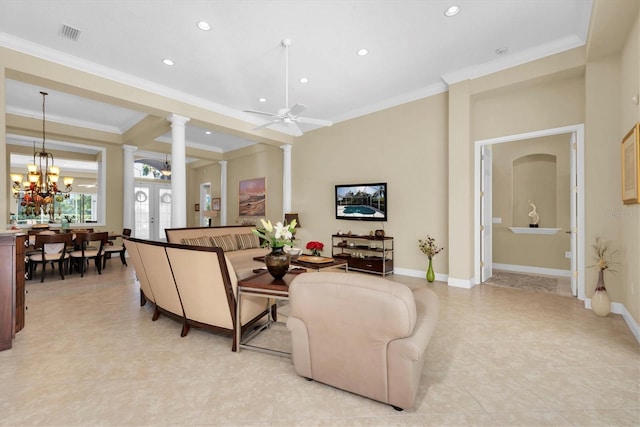 living room with ornate columns, light tile patterned floors, ceiling fan with notable chandelier, and ornamental molding