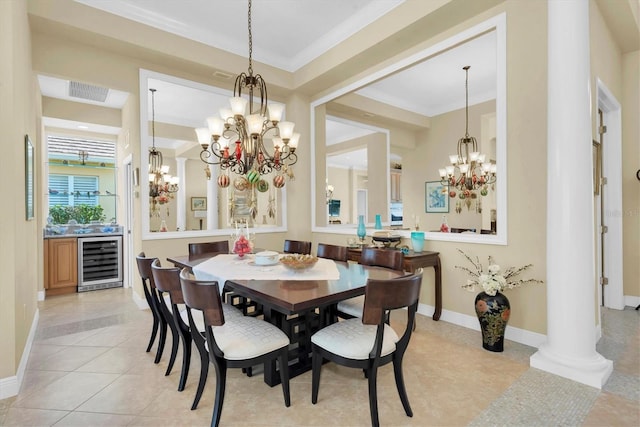 dining area featuring light tile patterned flooring, ornamental molding, beverage cooler, and ornate columns