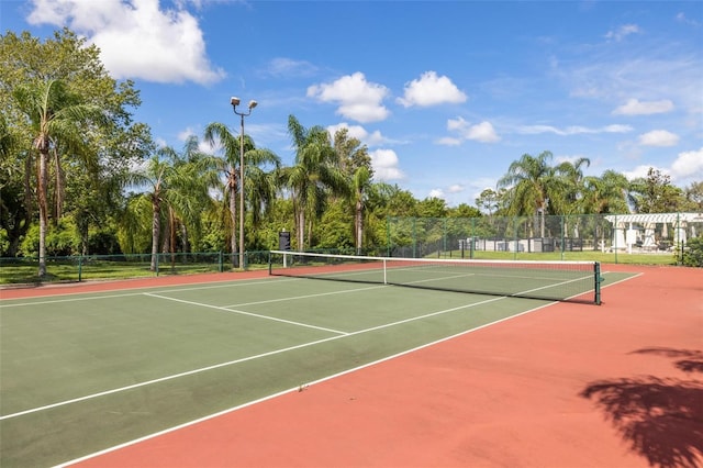 view of sport court with basketball hoop