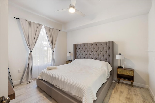 bedroom featuring ceiling fan and light hardwood / wood-style floors