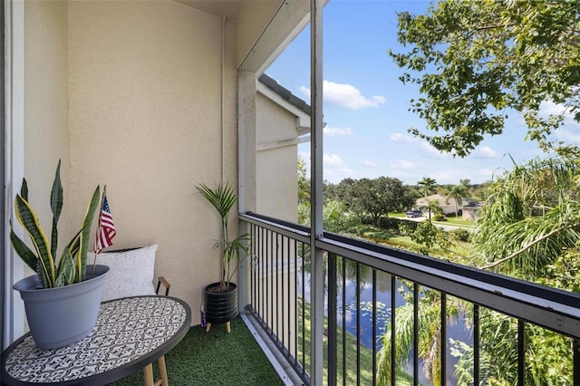 balcony featuring a water view