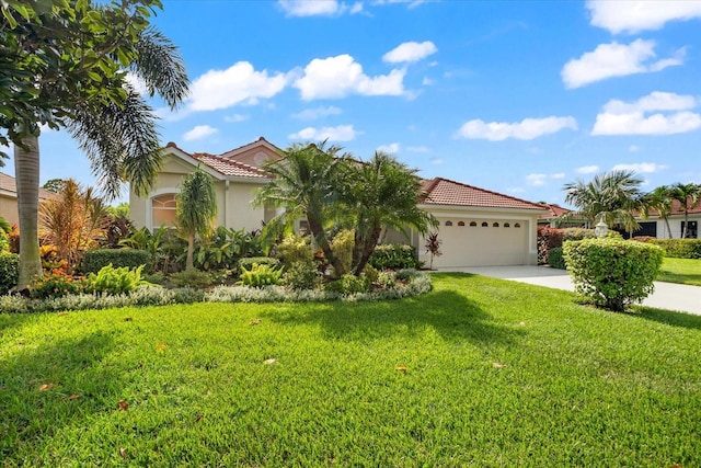 mediterranean / spanish-style home featuring a front yard and a garage