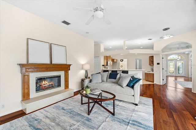 living room with hardwood / wood-style flooring and ceiling fan