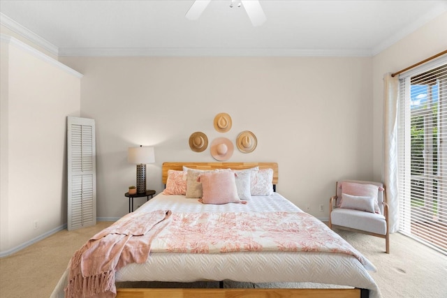 bedroom with carpet flooring, ceiling fan, and crown molding