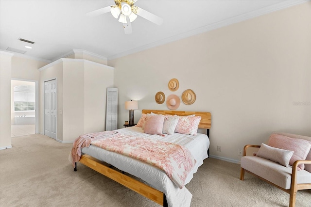 carpeted bedroom with crown molding, a closet, and ceiling fan