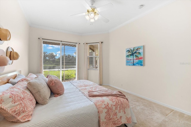 bedroom featuring ceiling fan, crown molding, and light carpet