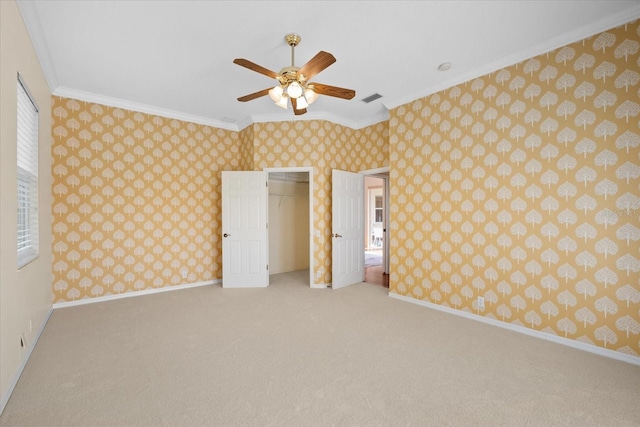 unfurnished bedroom with ceiling fan, light carpet, and ornamental molding