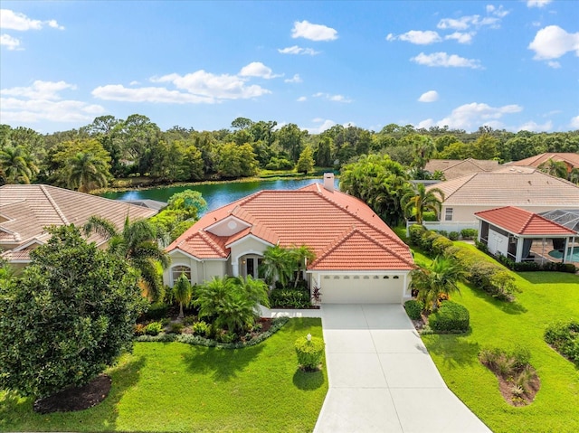 birds eye view of property with a water view