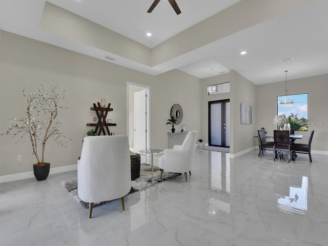 living room featuring french doors and ceiling fan