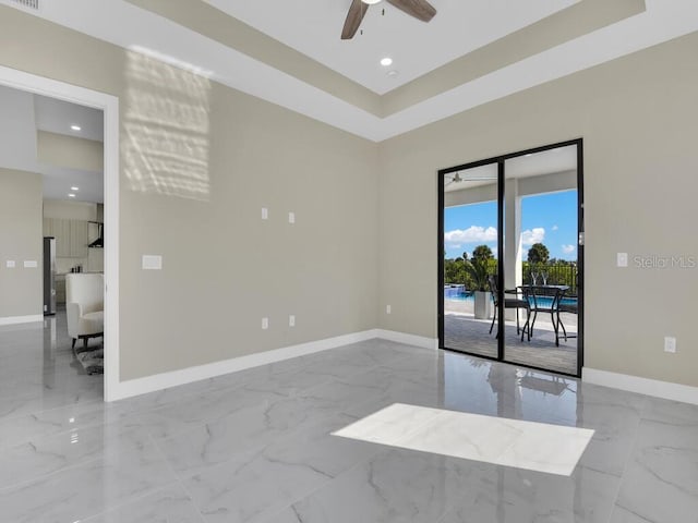 spare room with ceiling fan