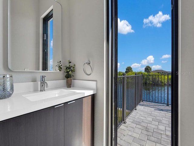 bathroom featuring a water view and vanity