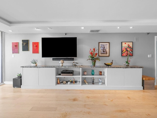 unfurnished living room with light wood-type flooring