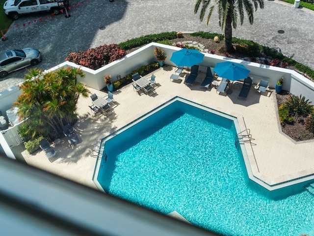 view of swimming pool with a patio area